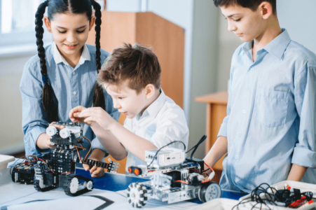 3 children looking at a toy remote learning tips and tricks