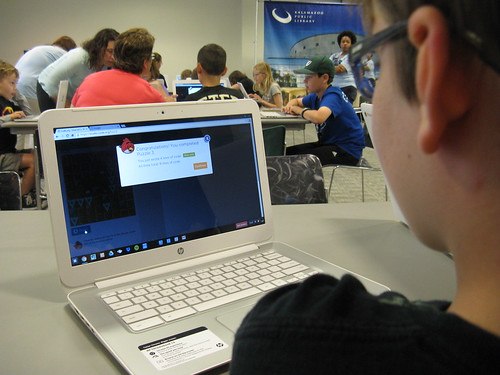 trachers in a class with students on laptops public speaking skills 