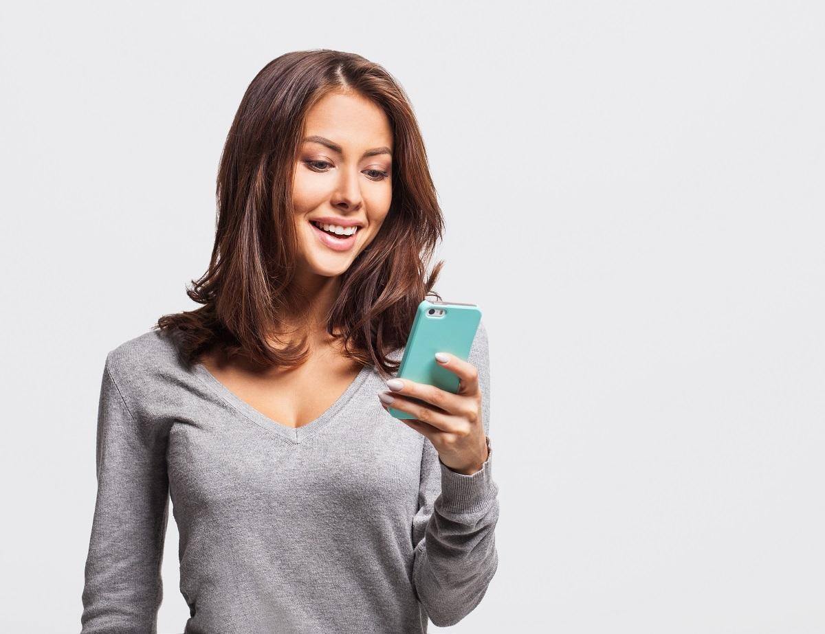 woman checking her schedule on her mobile phone