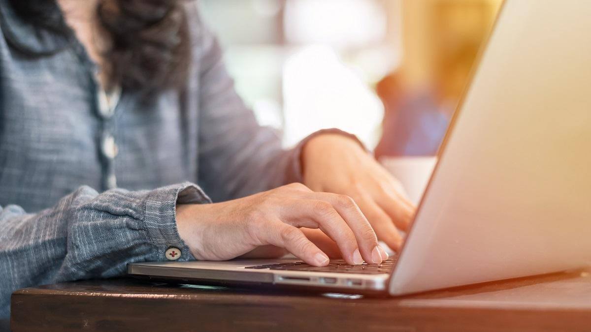 woman typing on open laptop proven time management tips