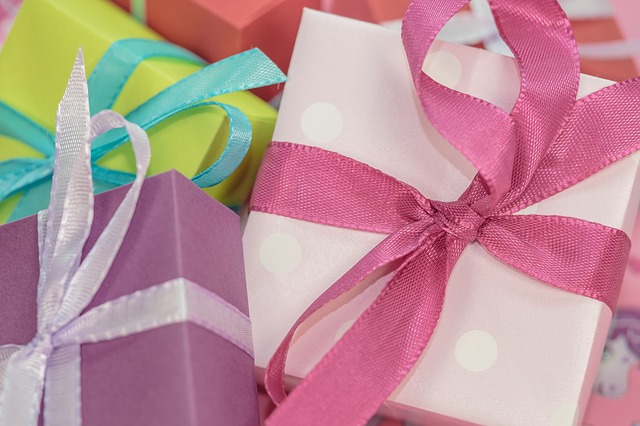 gift boxes with bows in pink green and white