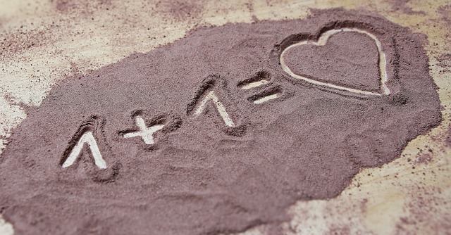one plus one equals love drawn in the sand