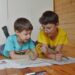 two young boys in class home schooling options